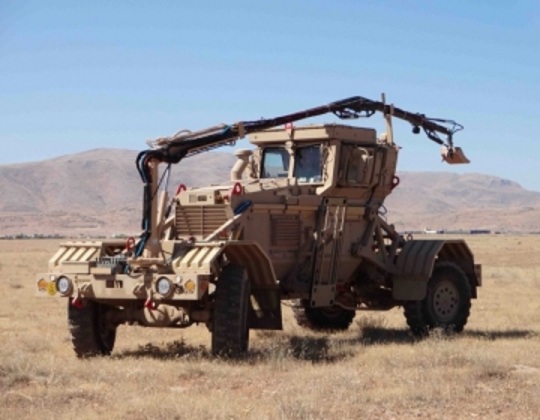 Husky vehicle with interrogation arm